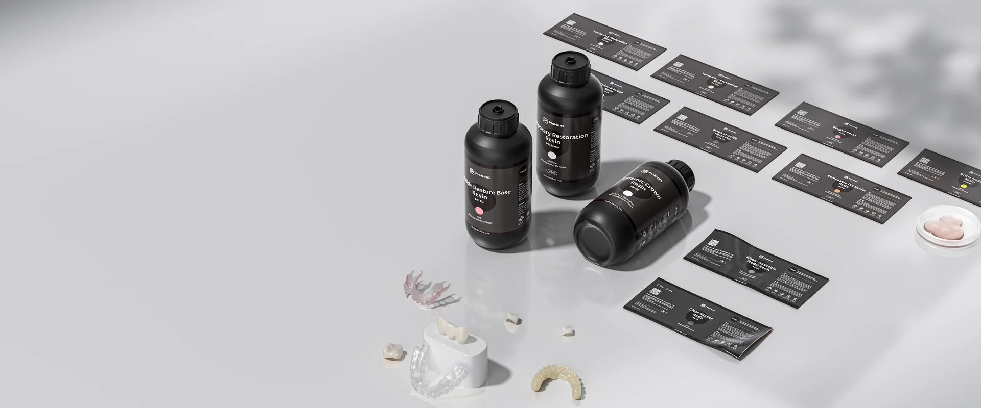 PioCreat dental resin bottles and printed dental application samples