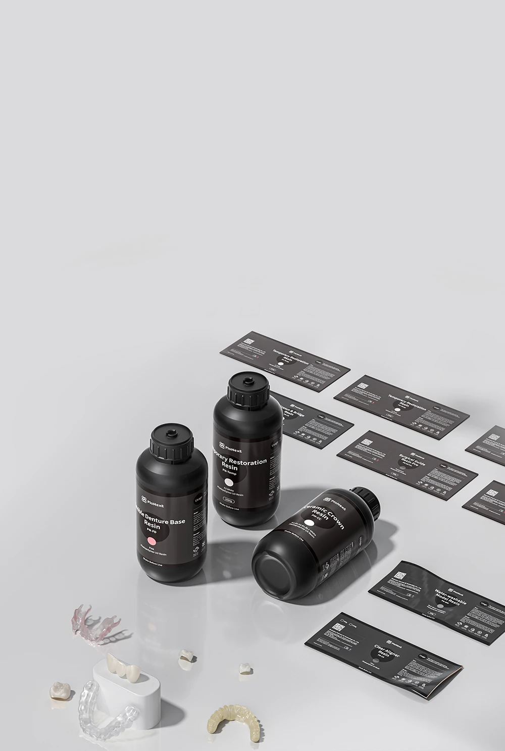 PioCreat dental resin bottles and printed dental application samples