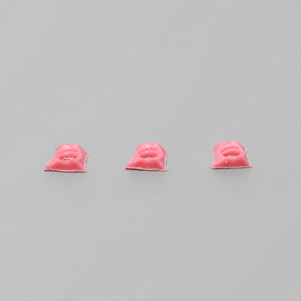Three pink gingiva inserts made with PioNext Gingiva Resin