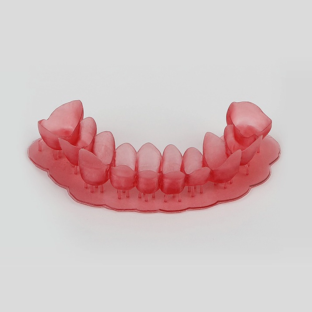 Red full-arch dental casting pattern with printing supports