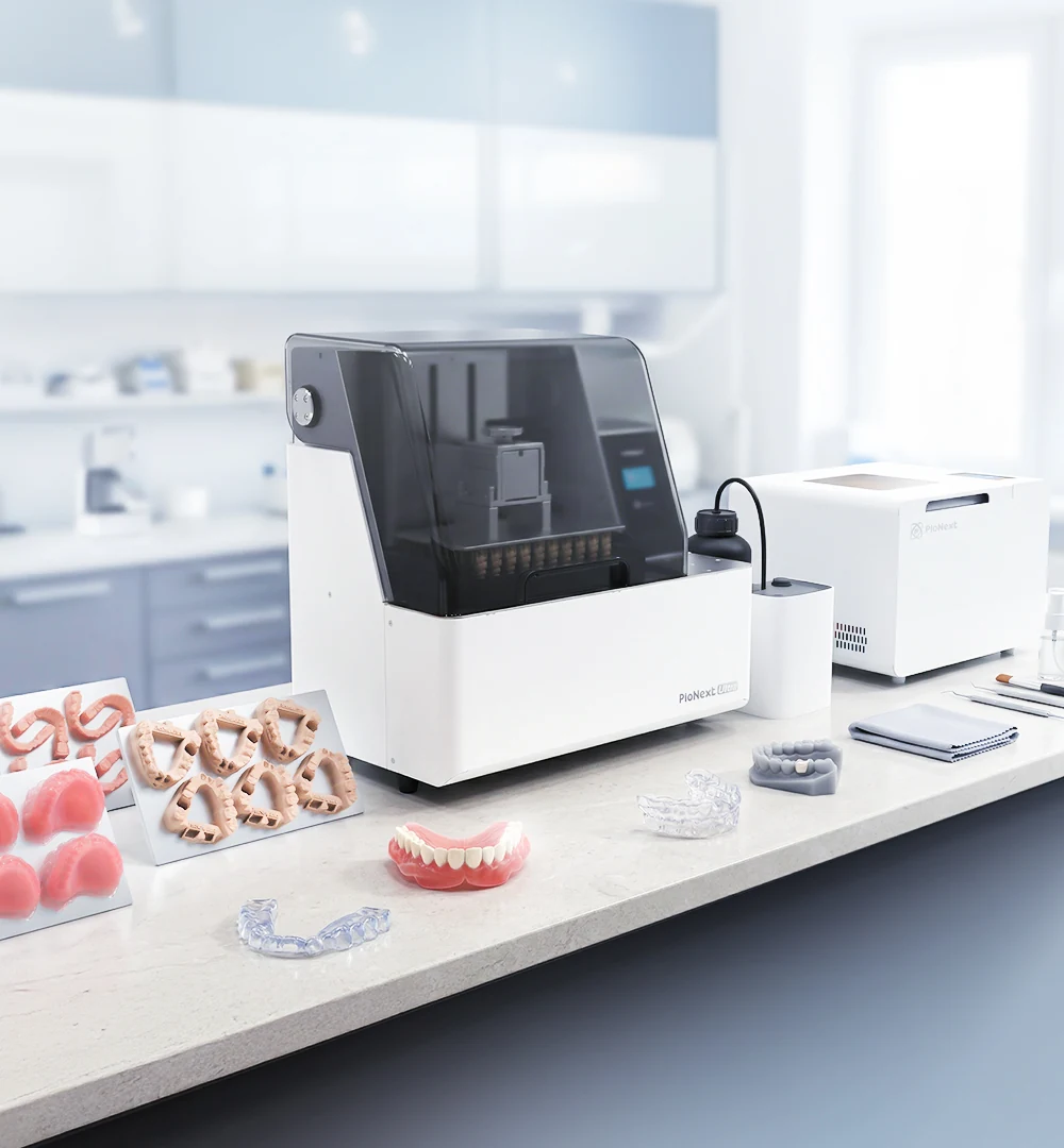 PioNext Ultra and post-processing equipment on a dental laboratory worktop