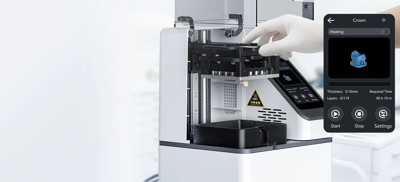 Removing a printed crown from the PioNext Mini with its touchscreen shown